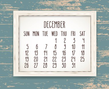 Aralık 2021 vektör takvimi. Pazar gününden itibaren hafta başlıyor. Ahşap bir çerçeveye elle çizilmiş bir metin kırsal tedirgin deniz mavisi ahşap zemin üzerine..