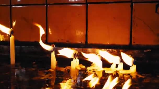 Prayer Candles Burning Water Catholic Church Glowing Fire Dark Religious — Stock Video