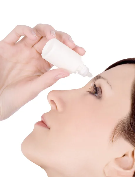 Woman dripping eye with eyes drops — Stock Photo, Image