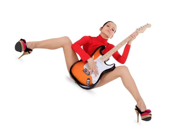 Sexy young female posing with guitar over white — Stock Photo, Image