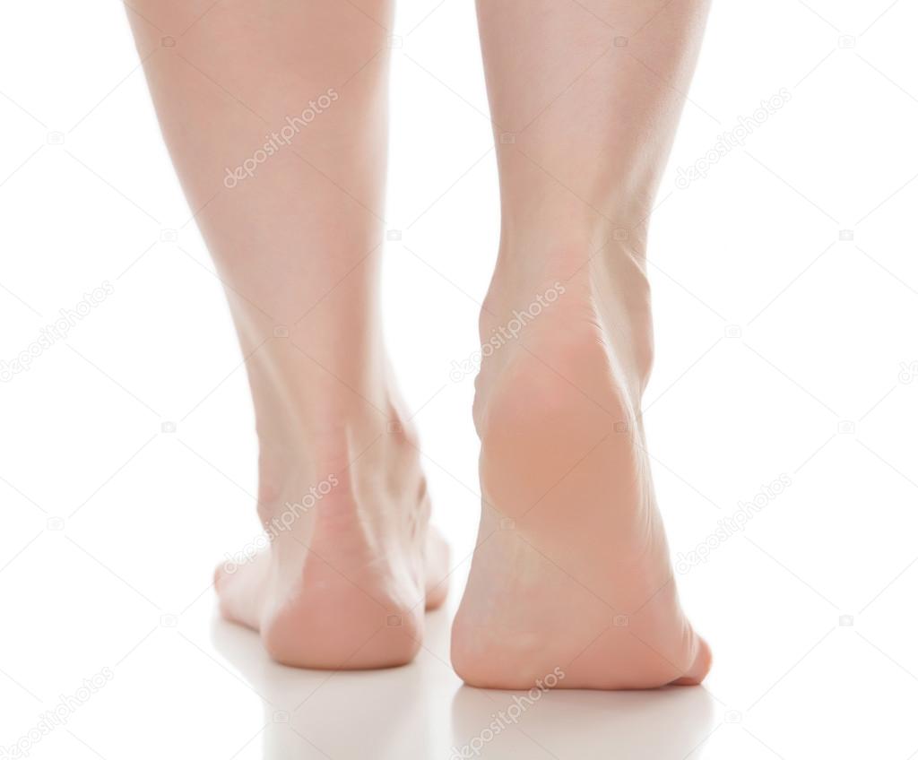 Female feet isolated on white background