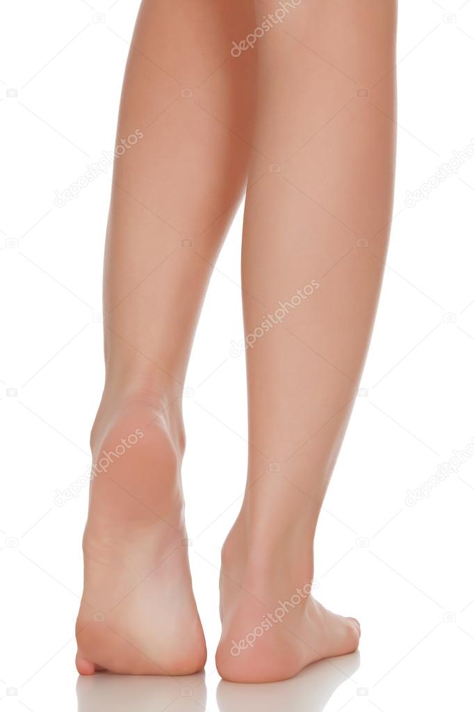 Female feet isolated on white background