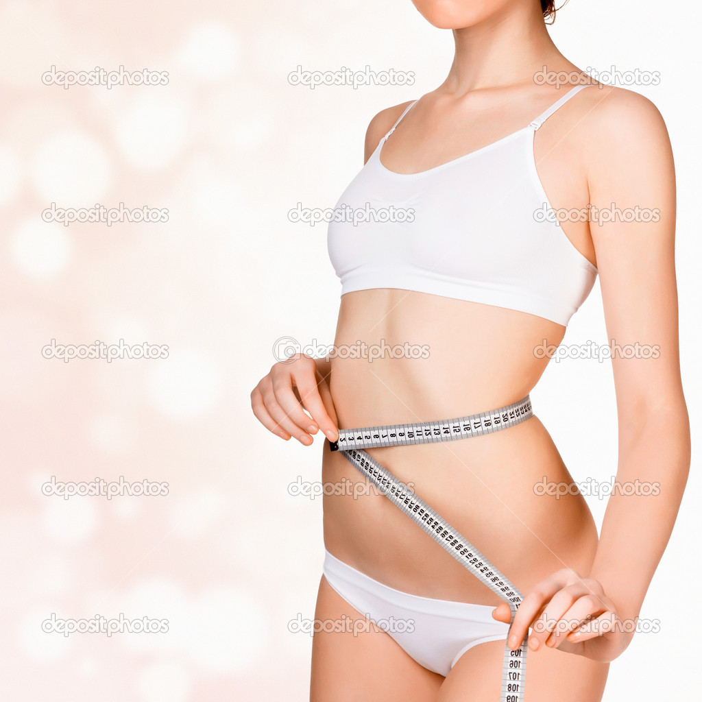 Woman taking measurements of her body