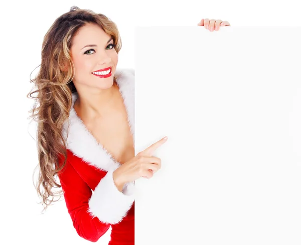 Θηλυκό santa δείχνει σε ένα άδειο banner — Φωτογραφία Αρχείου