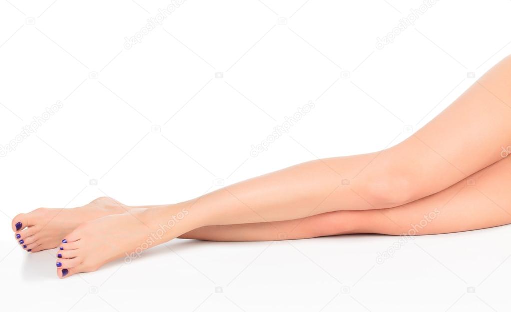 Female legs with blue toenails
