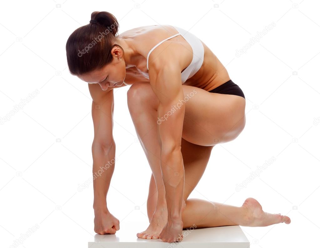 Muscular strong woman on a white background