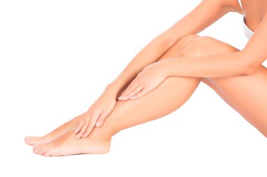 Smooth skin on female legs. White background clipart