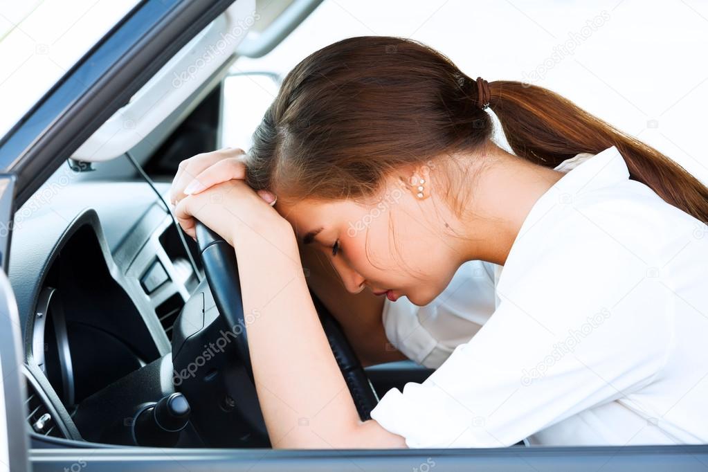 Girl sleeps in a car