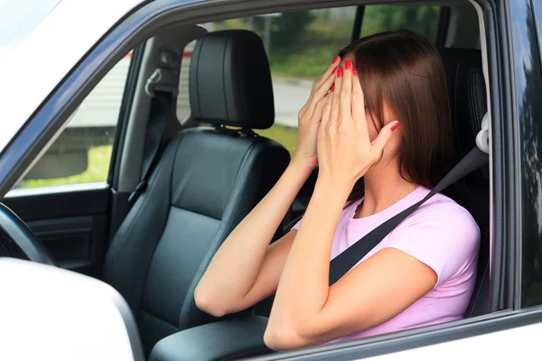 Crying woman in a car — Stock Photo, Image