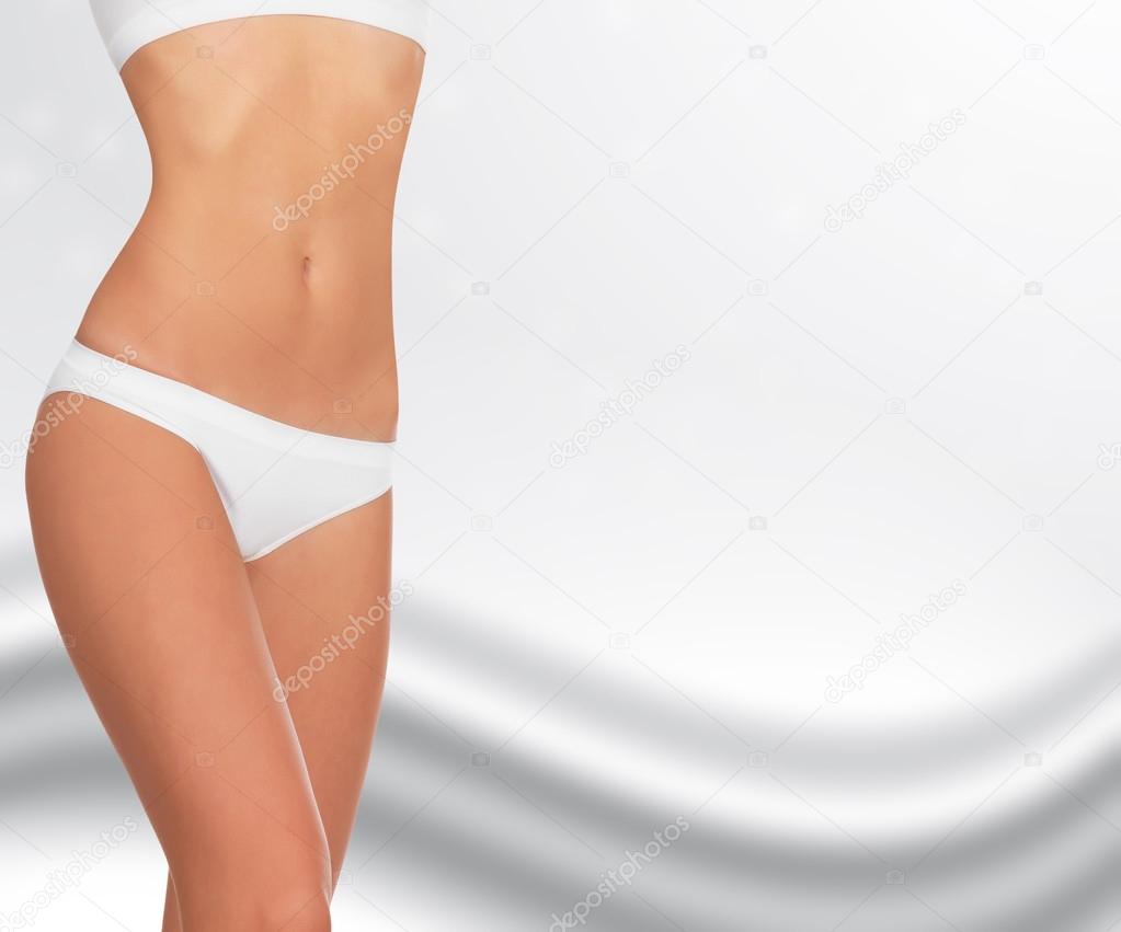 Slim woman against abstract background