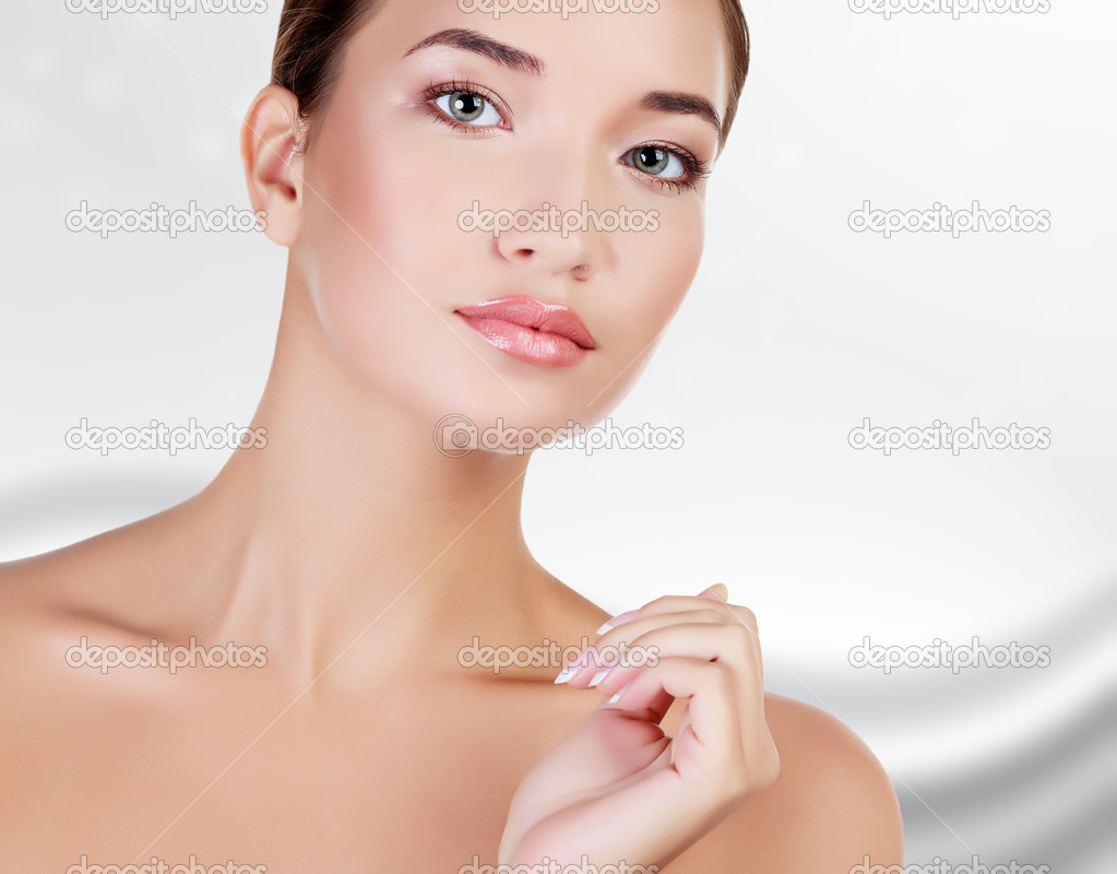 Beautiful asian girl with clean fresh skin, abstract grey backgr