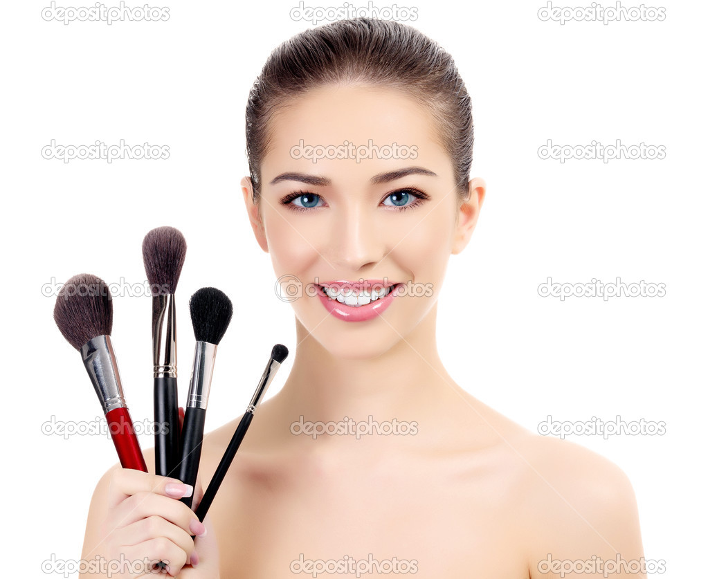 Female with cosmetic brushes