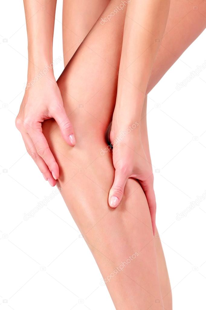 Woman holding sore knee, on white background