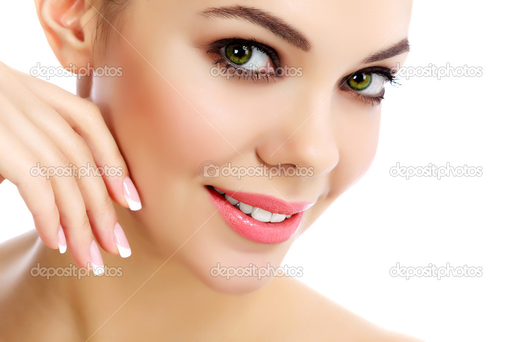 Cheerful female with fresh clear skin, white background