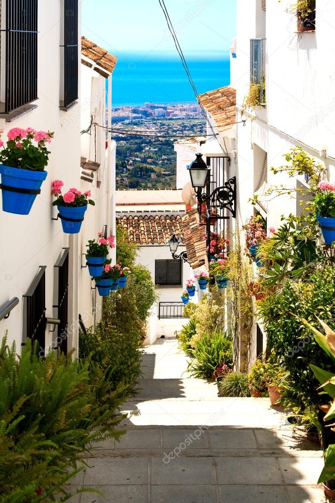 Beautiful street with flowers in the Mijas town, Spain