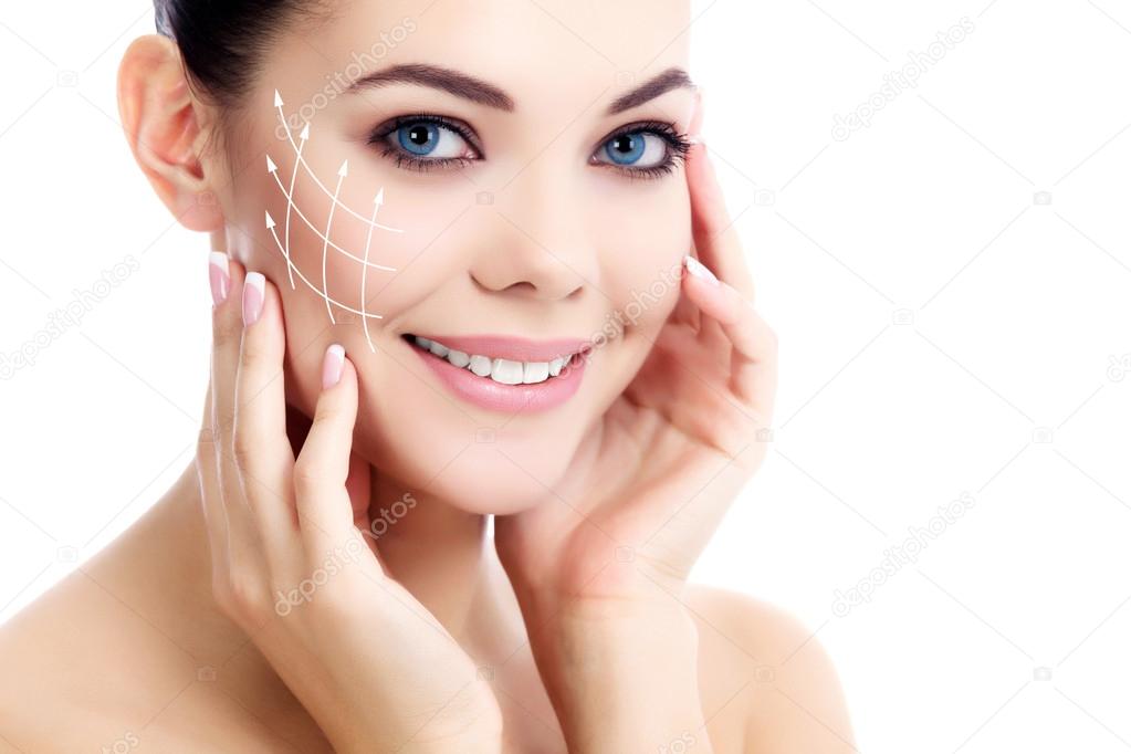 Young female with clean fresh skin, white background