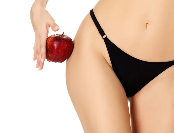 Mujer delgada con manzana, fondo blanco, copyspace — Foto de Stock