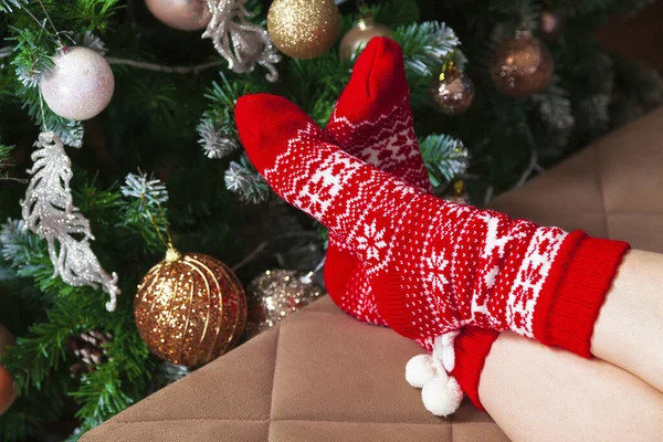 Female Feet Red Knitted Socks Decorated Christmas Tree — Stock Photo, Image