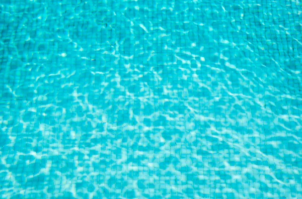 Blue mosaic swimming pool with clear water. Background. — Stock Photo, Image