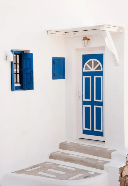 Old blue door and window and steps, painted white. Greece. Mykon — Stock Photo, Image