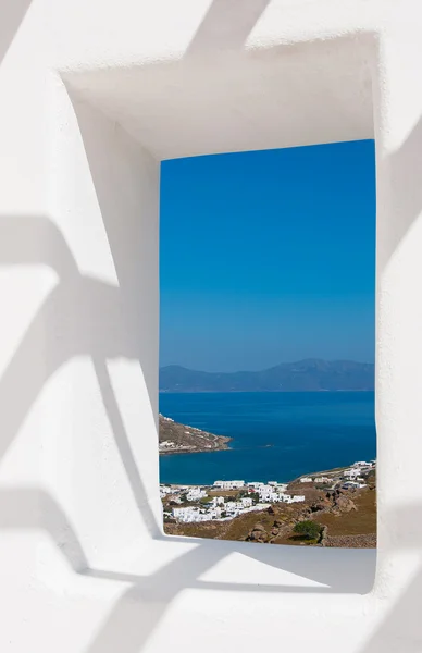 View through a white wall window to the sea and coast — Stock Photo, Image
