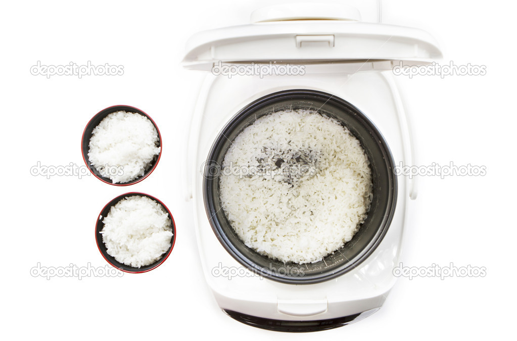 Cooked rice in cooker pot.