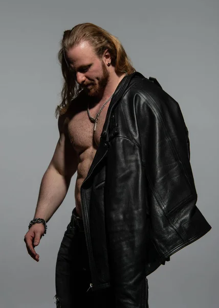 Fitness male model in leather jacket