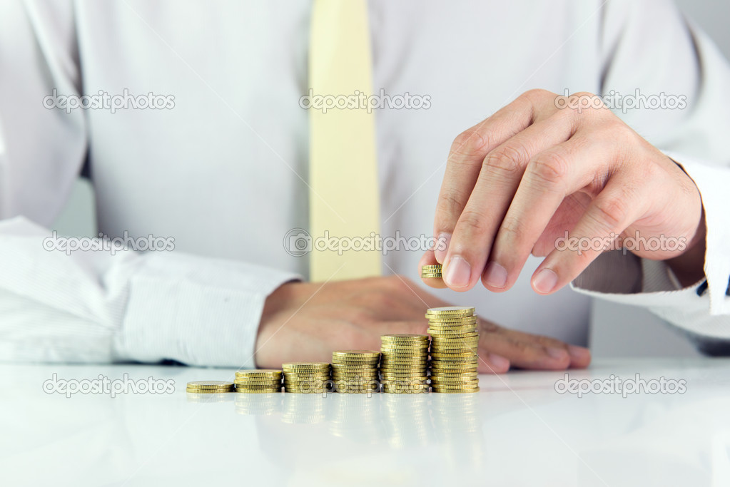 Businessman with gold coins