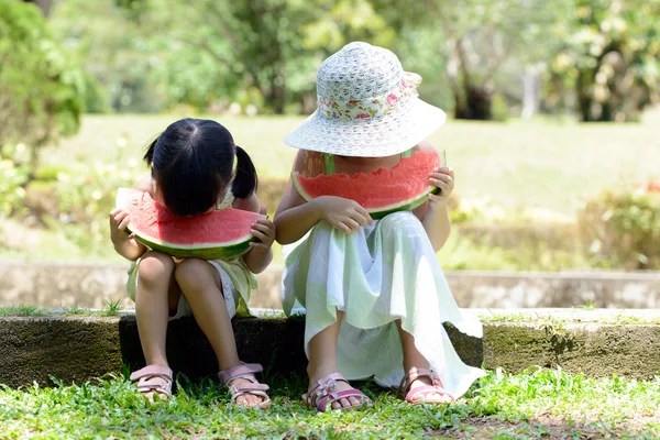 Little kids eating watermelon — Stock Photo, Image