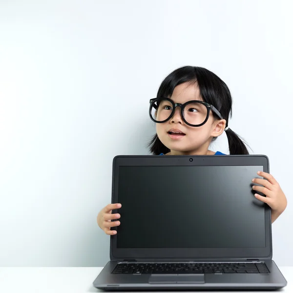 Baby girl with laptop — Stock Photo, Image