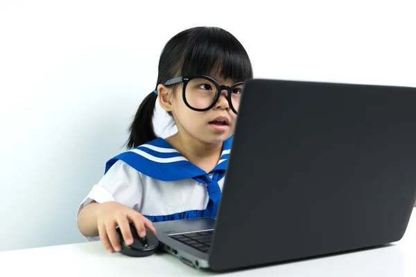 Baby girl using laptop — Stock Photo, Image