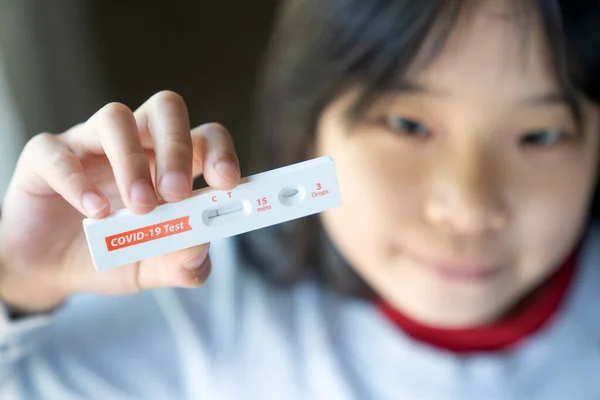 Little Girl Showing Negative Results Test Strip Rapid Antigen Home —  Fotos de Stock