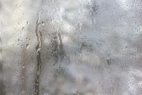 Frozen drops on frosted glass. Winter textured background. — Stock Photo, Image