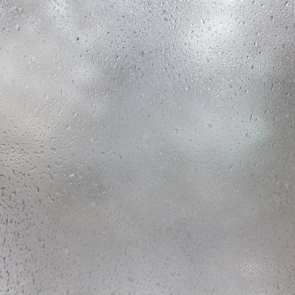 donmuş damla buzlu cam üzerinde. Kış dokulu arka plan.