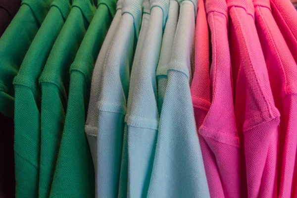 T-shirts on hangers. — Stock Photo, Image