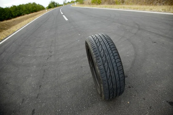 Wheel on road — Stock Photo, Image