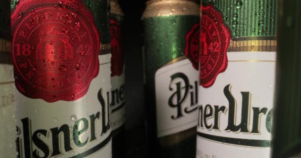 Pilsner Urquell beer cans with probe lens — Stock Video