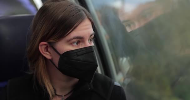 Woman on a train wearing mask — Stock Video