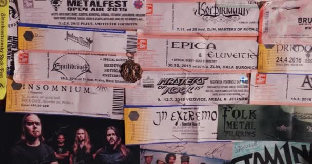 Concert tickets on a wall, rock and metal music — Stock Video