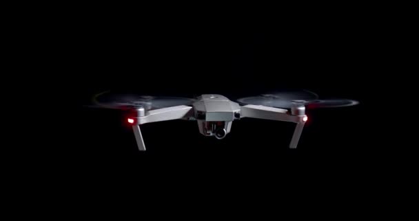 Drone spinning propellers on black background — Stock Video