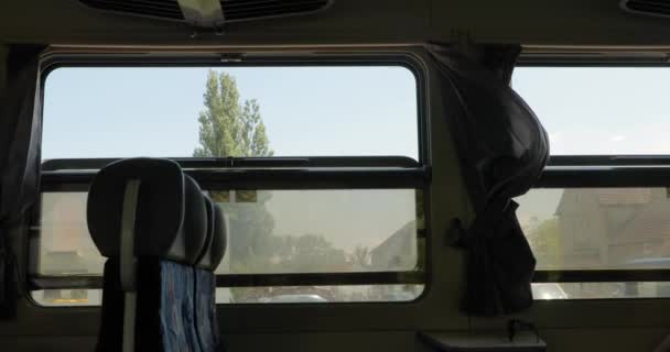 Railway journey open windows, slow passing village — Wideo stockowe