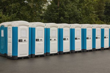 Toilets installed at a public event clipart