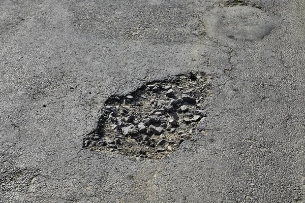 Potholes az úton — Stock Fotó