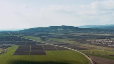 Countryside agricultural fields and road aerial view