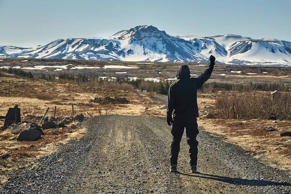 Man walking on gravel road in Iceland — Stock Photo, Image