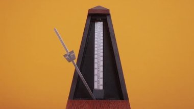 Classic metronome clicking in slow motion from 120 fps