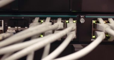 Network cables plugged into a switch at an only data center server room