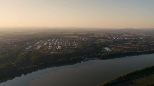 Oil Refinery Fuel Storage Silos River Aerial View Drone Footage — стоковое видео