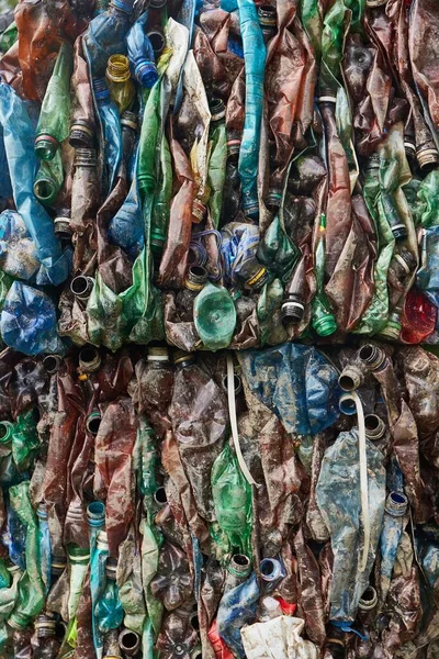 Plastic waste pile, PET bottles collected into bales for recycling