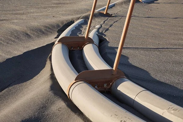 Pipes Lying Black Sand Iceland — Stock Photo, Image